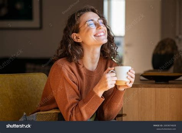 A confident woman enjoying her garden while wearing practical and stylish summer attire