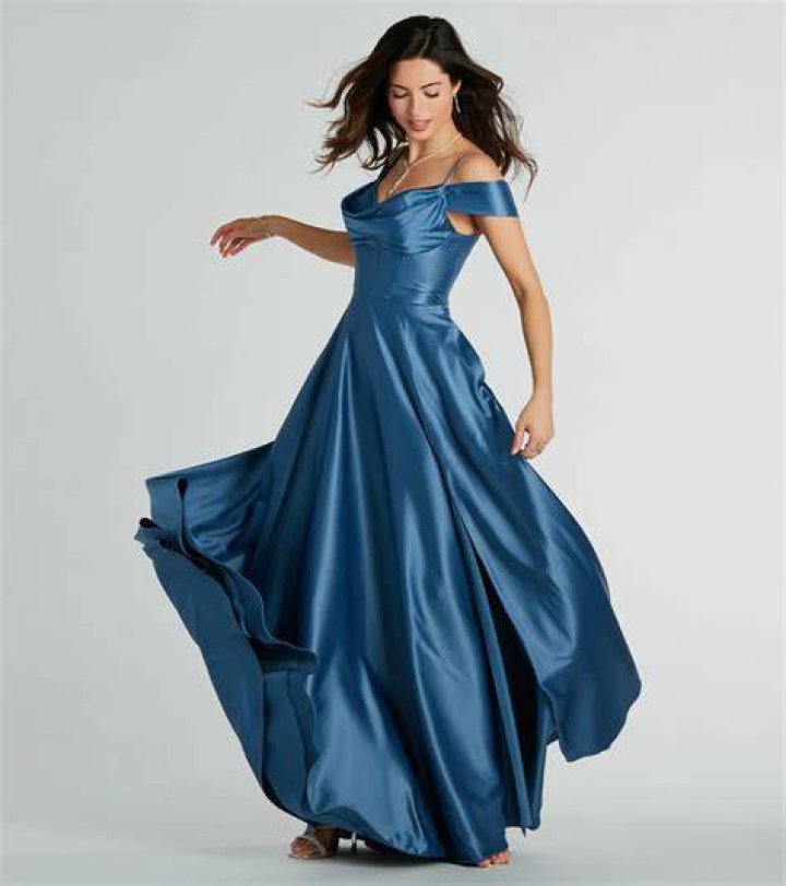A flowy, knee-length blue dress with short sleeves, perfect for a summer picnic, looking relaxed and stylish