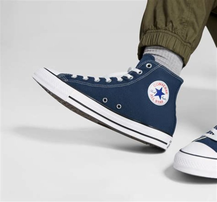 Comfortable white converse with colored laces festival attendee