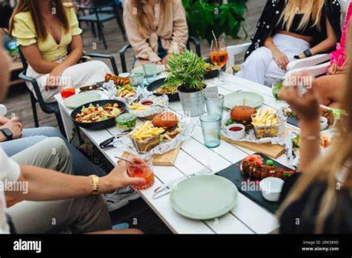 Group of people enjoying a backyard gathering