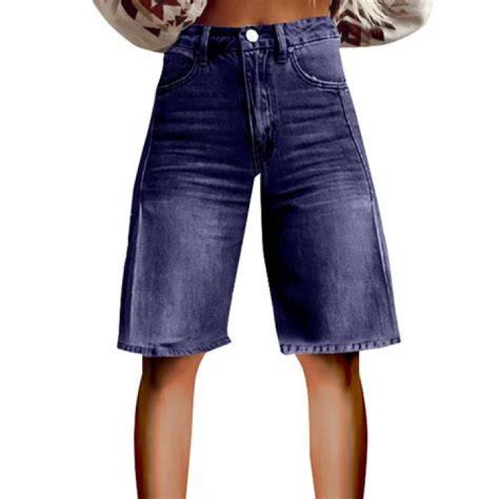 Wide leg vintage denim shorts on a model in a boho summer outfit