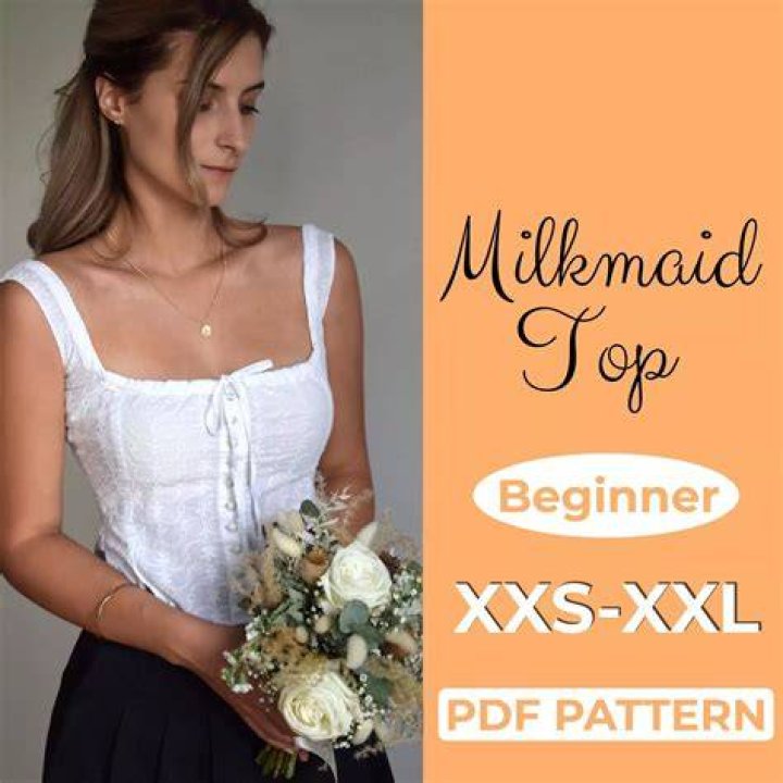 Woman wearing a minimalist milkmaid braid hairstyle in natural sunlight